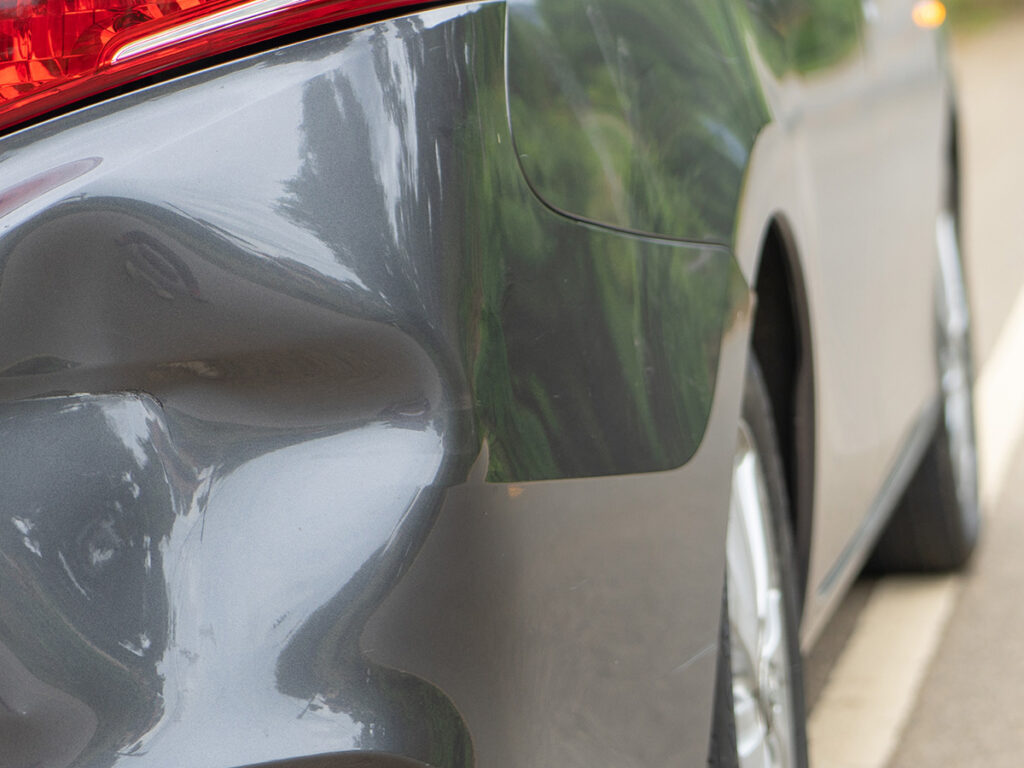 Image of a car with a dent
