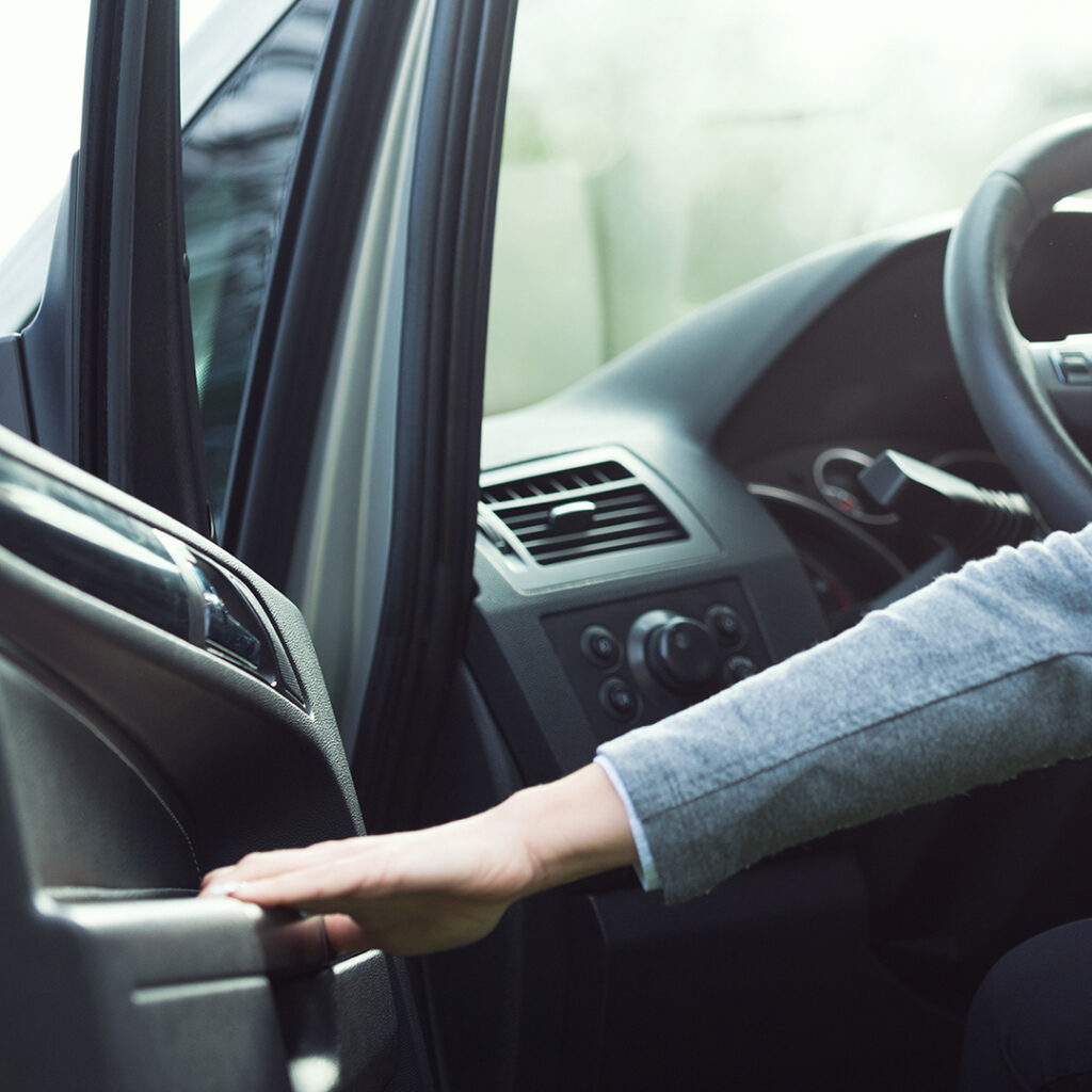 Image of a woman opening a car door