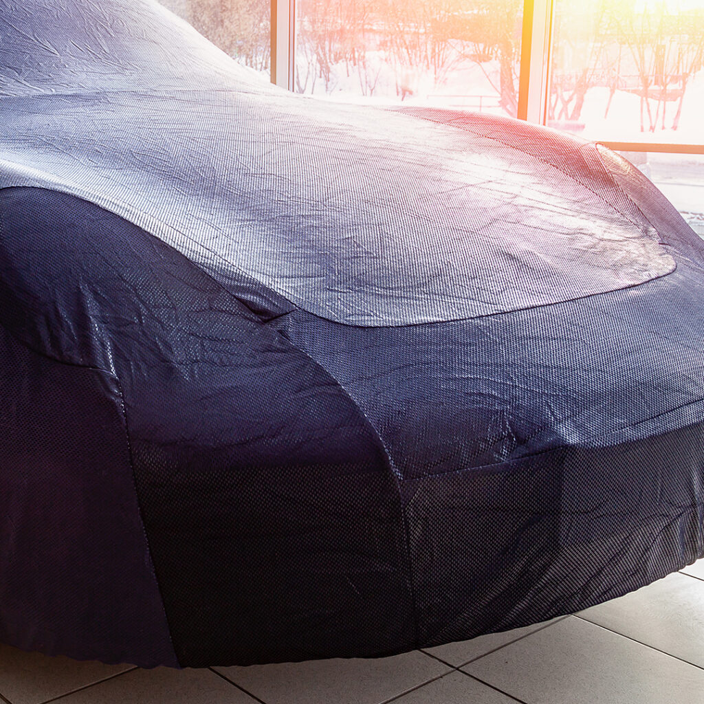 Image of a car with a cover over it.